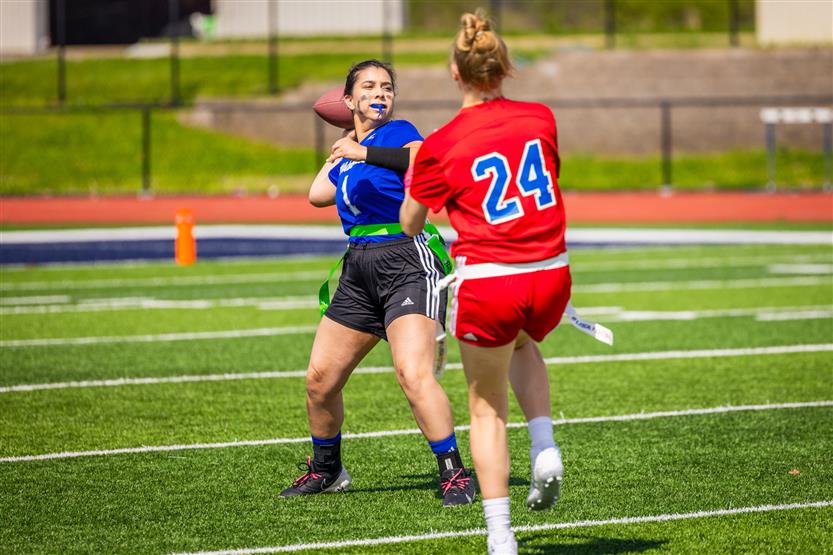 Students play flag football